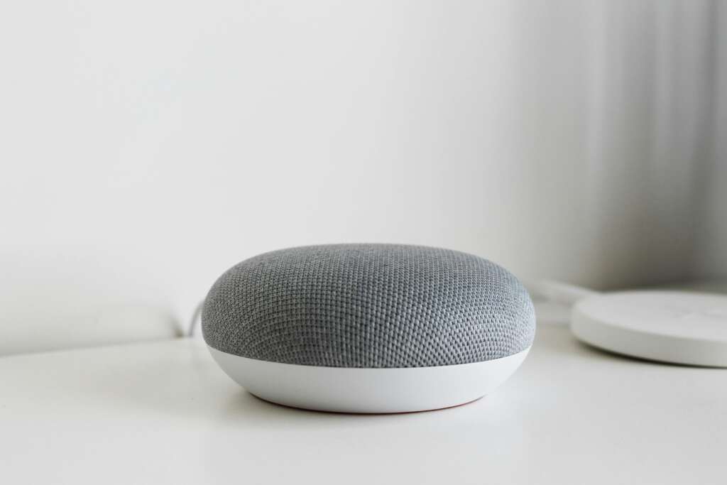 Metallic Gray Speaker on a White Surface